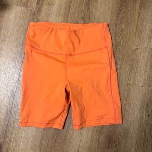 Athleta Women's Orange Biker Shorts with pockets size medium